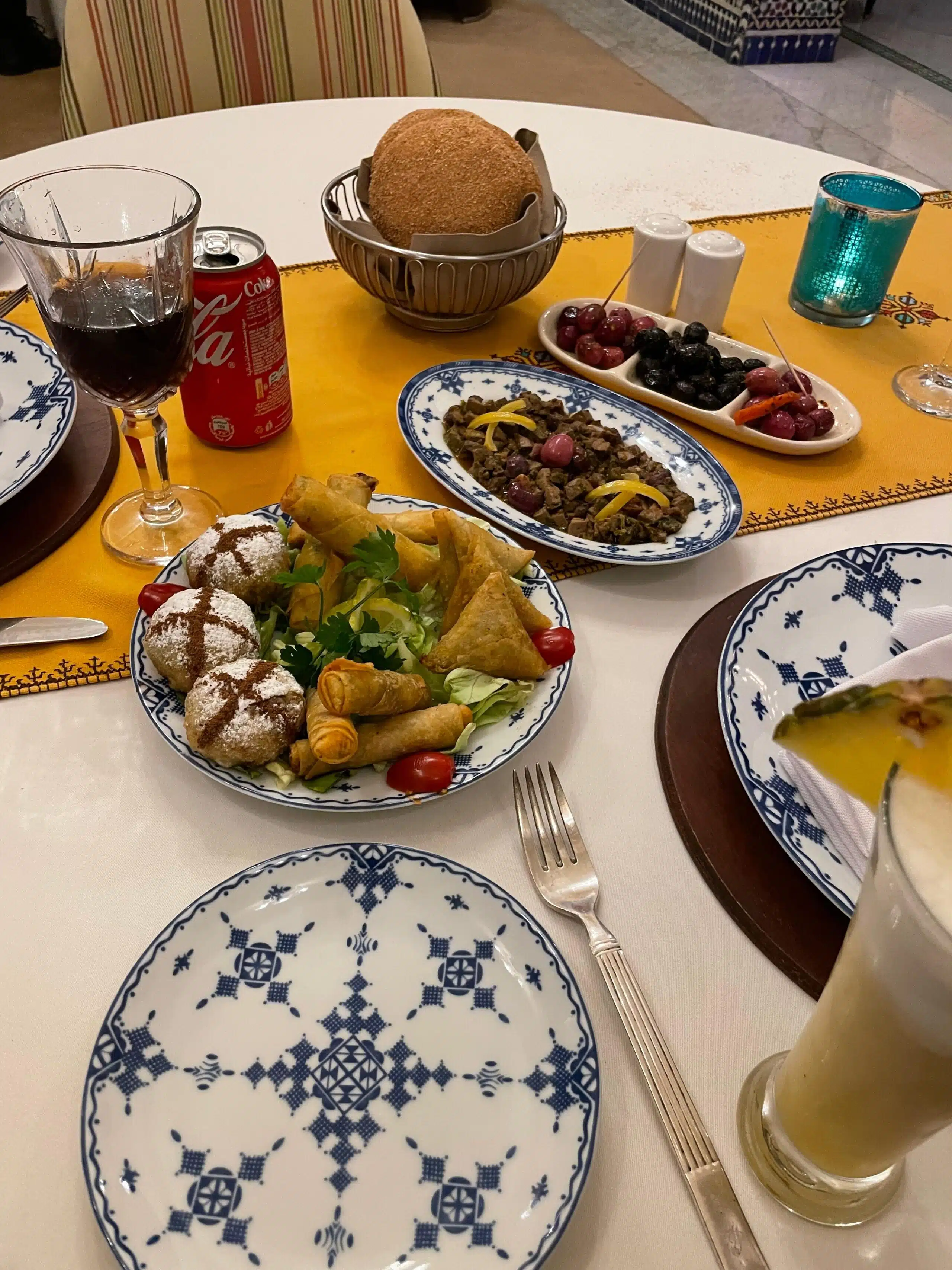 Briouats, olives and fresh bread — a typical Moroccan restaurant spread.